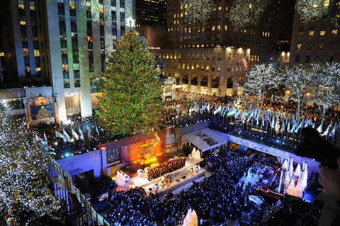 The 74-foot-tall Rockefeller Center Christmas Tree is lit by 30,000 energy efficient LED lights in the 79th annual lighting ceremony, Wednesday, Nov. 30, 2011 in New York. (AP Photo/Henny Ray Abrams)