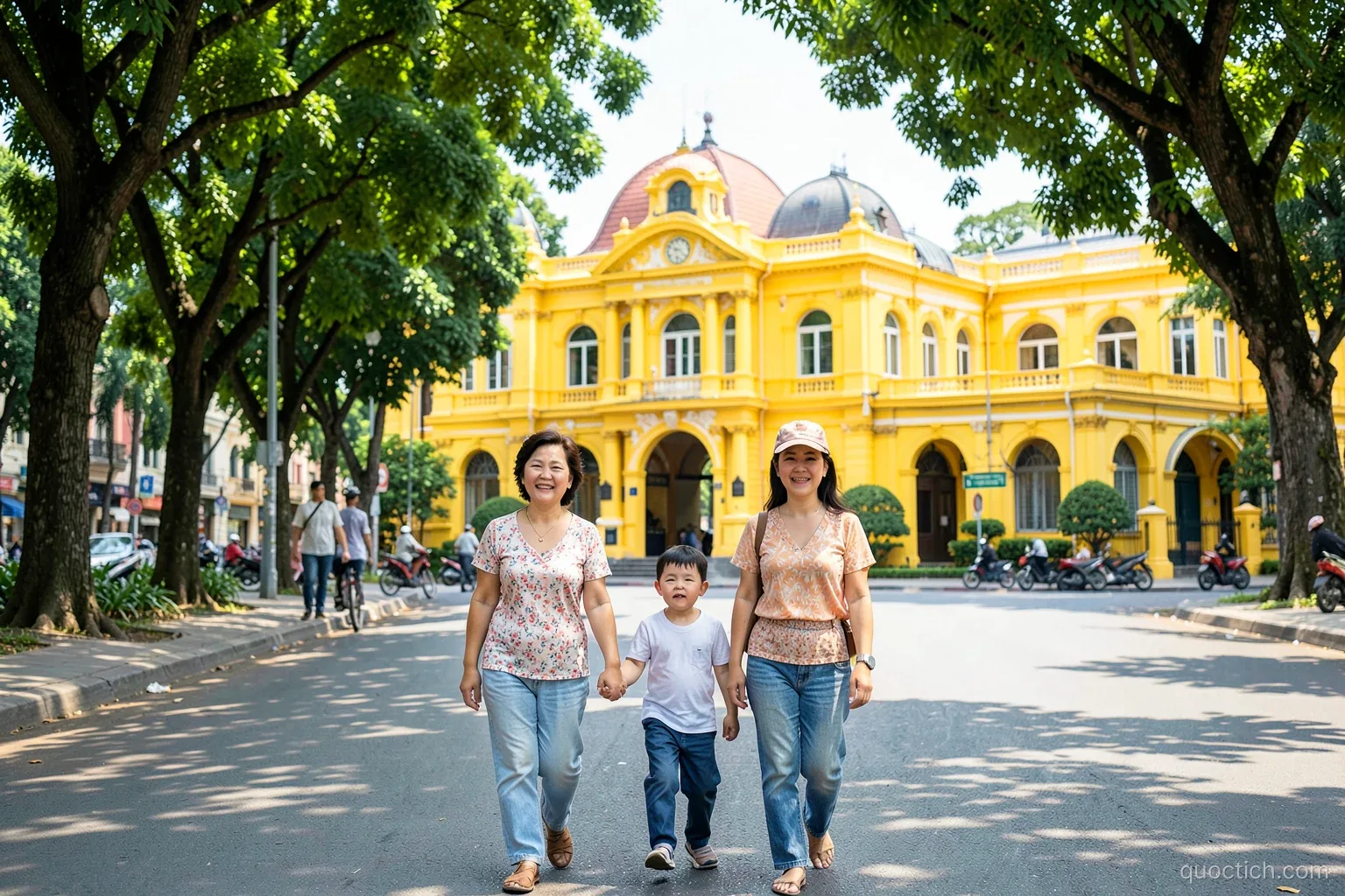 Three-generation Vietnamese family walking along the tree-shaded boulevard beside the bright yellow French colonial Presidential Palace in Hanoi, wide shot, sunny morning, green and yellow tones